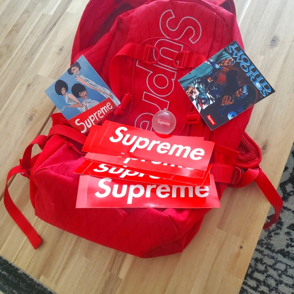 Supreme backpack with stickers and bouncy ball